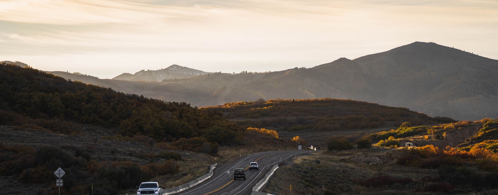 A two-lane highway curving through a Colorado mountain valley, the kind of long ambulance run that decides what a Medicare emergency transport costs in Aspen, Snowmass and the Roaring Fork Valley